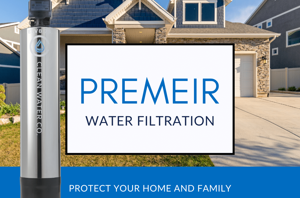 A water filtration unit is displayed outside a suburban home with a Clean Water Co. sign promoting advanced filtration.